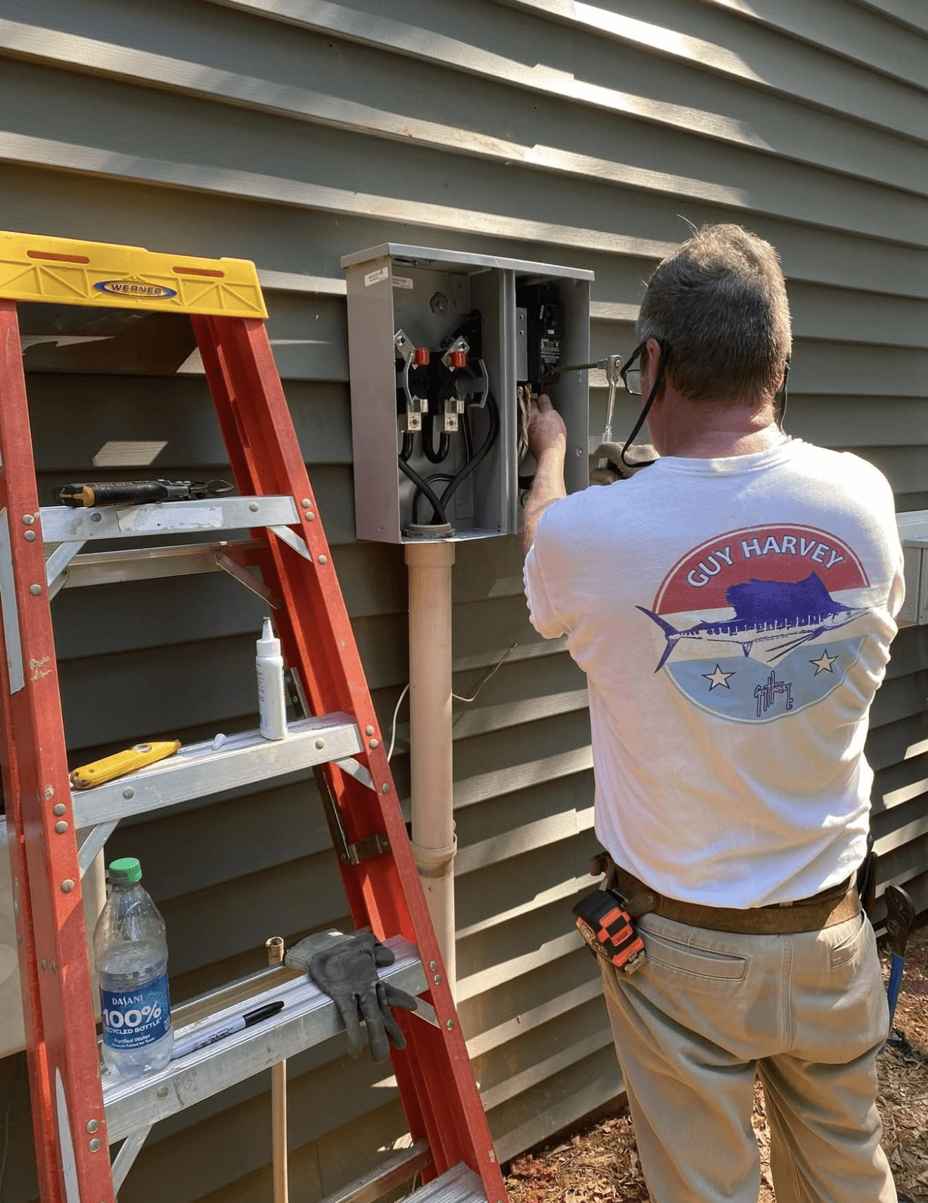 Letrix electrician at exterior service panel